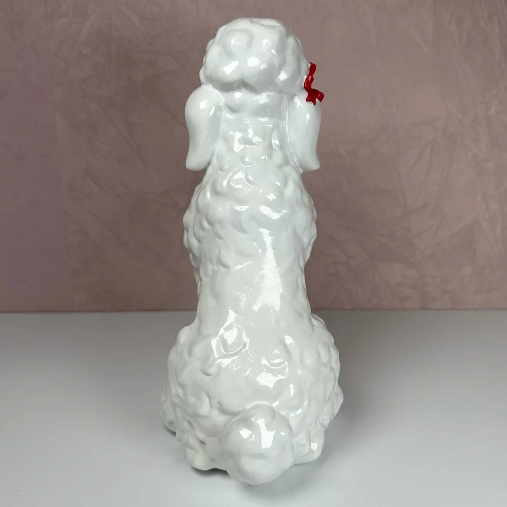HomeGoods White Poodle Figurine with Red HomeGoods Bag